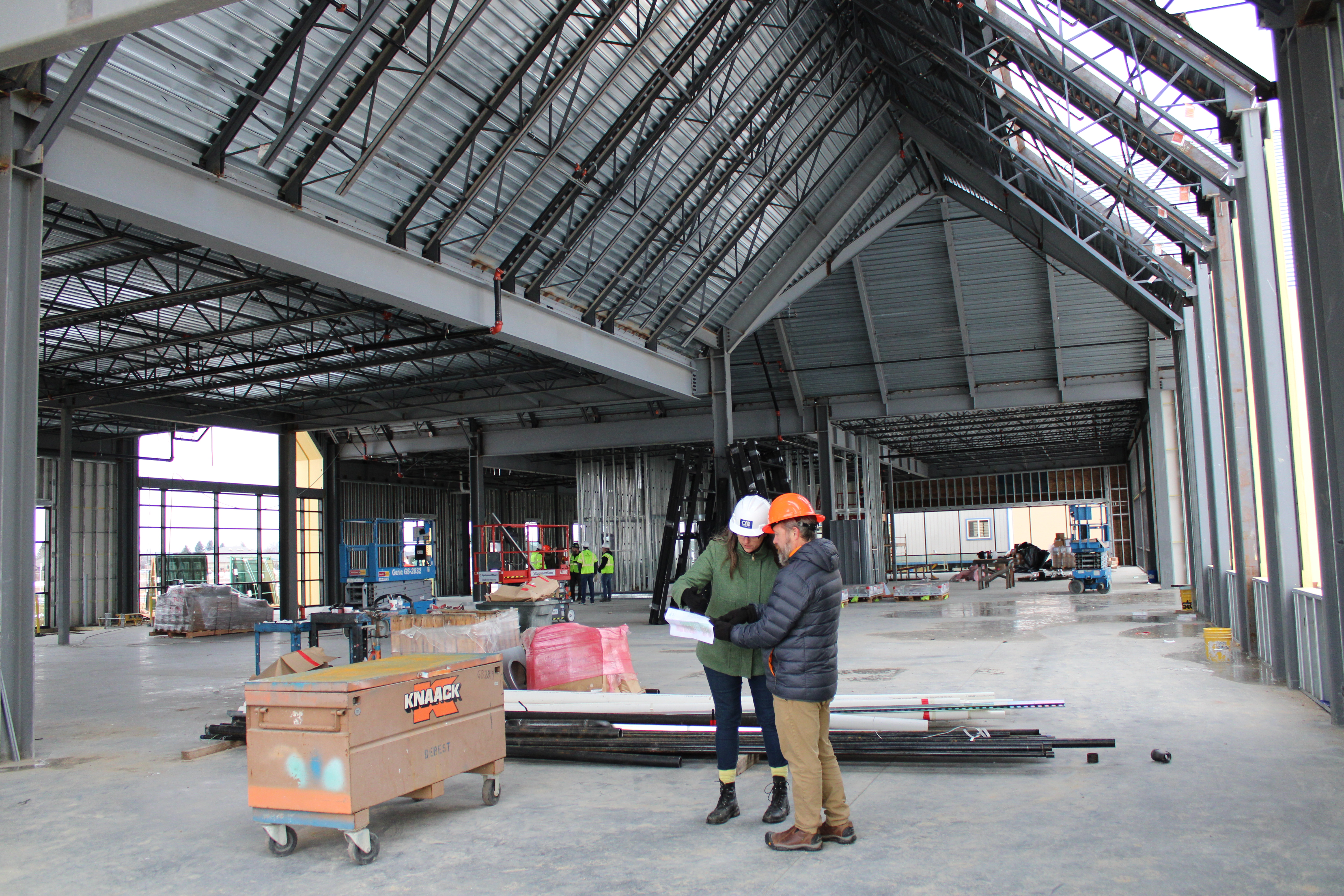 Orchard Park Construction image showing workers in discussion