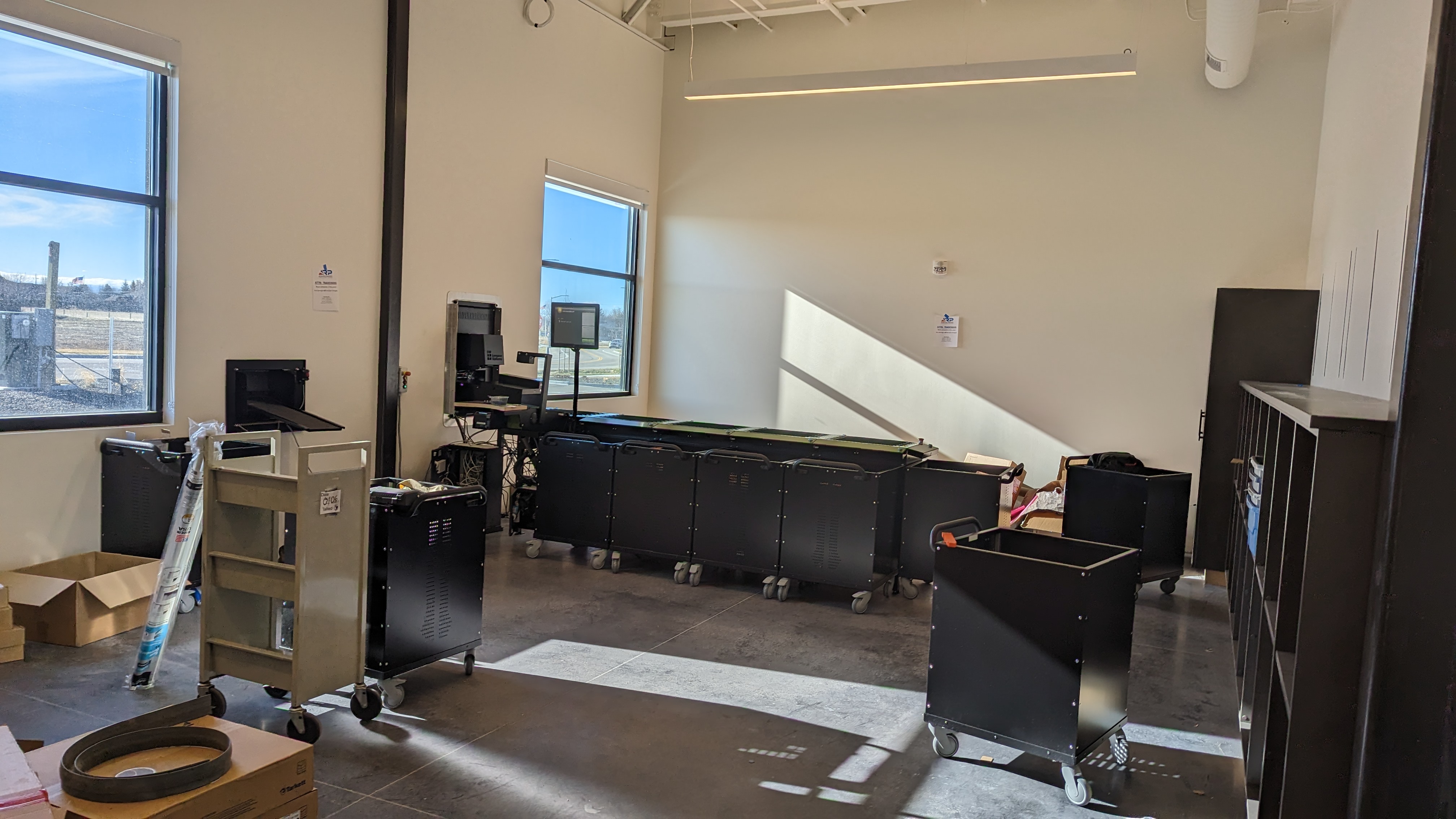 Orchard Park branch construction, staff workspace with book sorting machine.