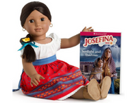 American Girl doll Josefina sitting and holding a book about her character.