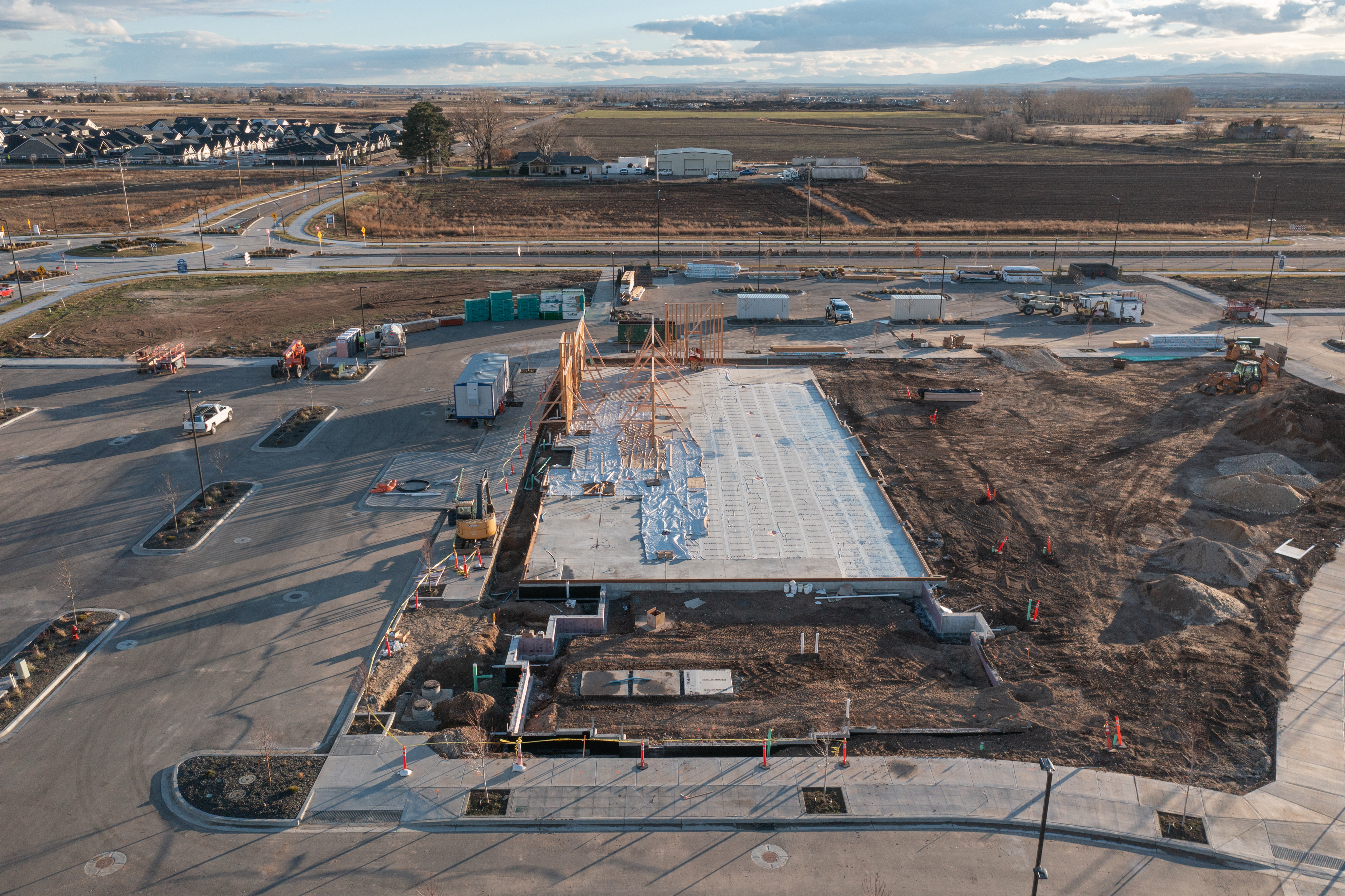 Pinnacle construction site with concrete set and framing starting to go up.