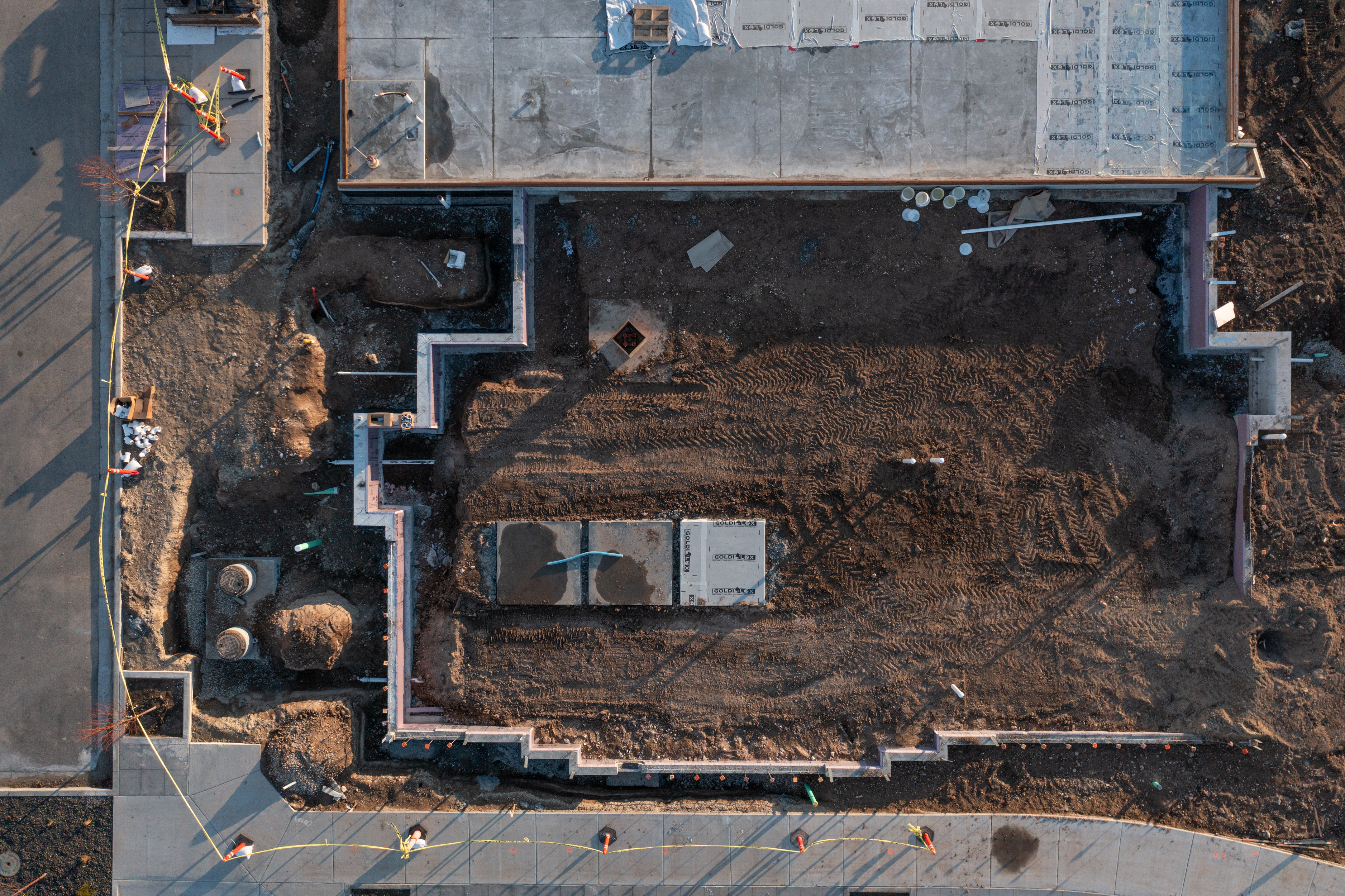 Pinnacle construction site with concrete set and framing starting to go up.