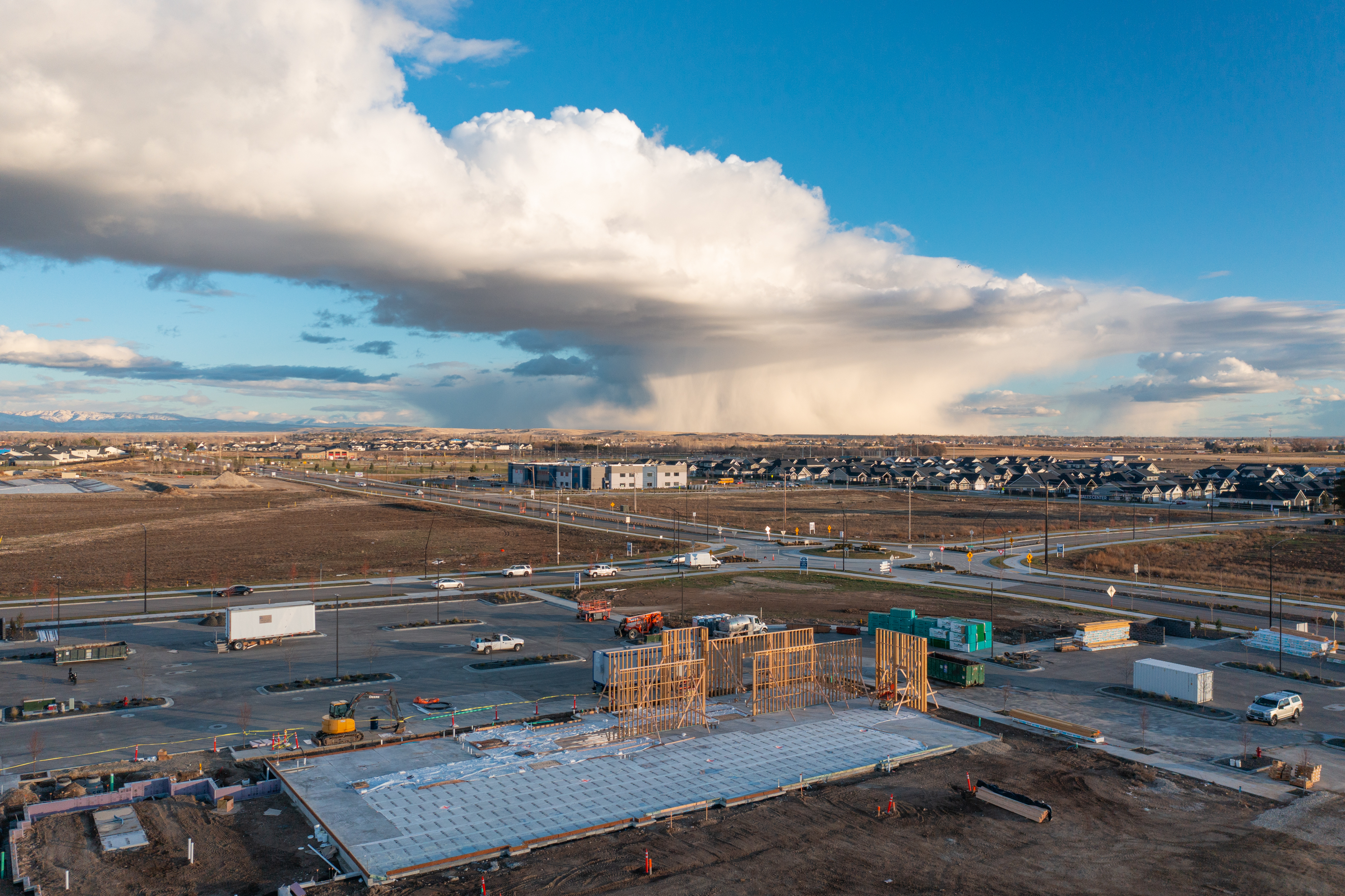 Pinnacle construction site with concrete set and framing starting to go up.