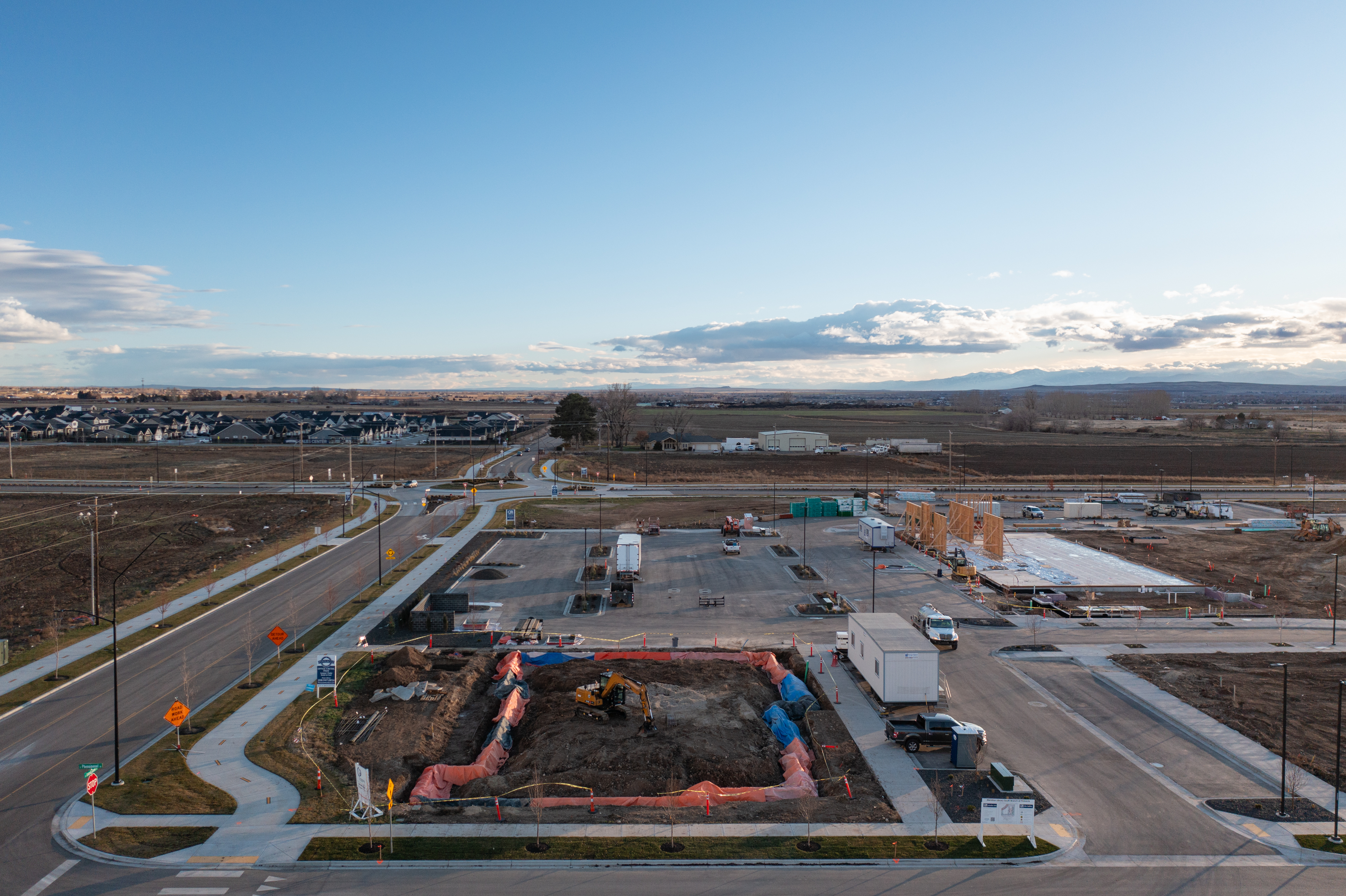 Pinnacle construction site with concrete set and framing starting to go up.