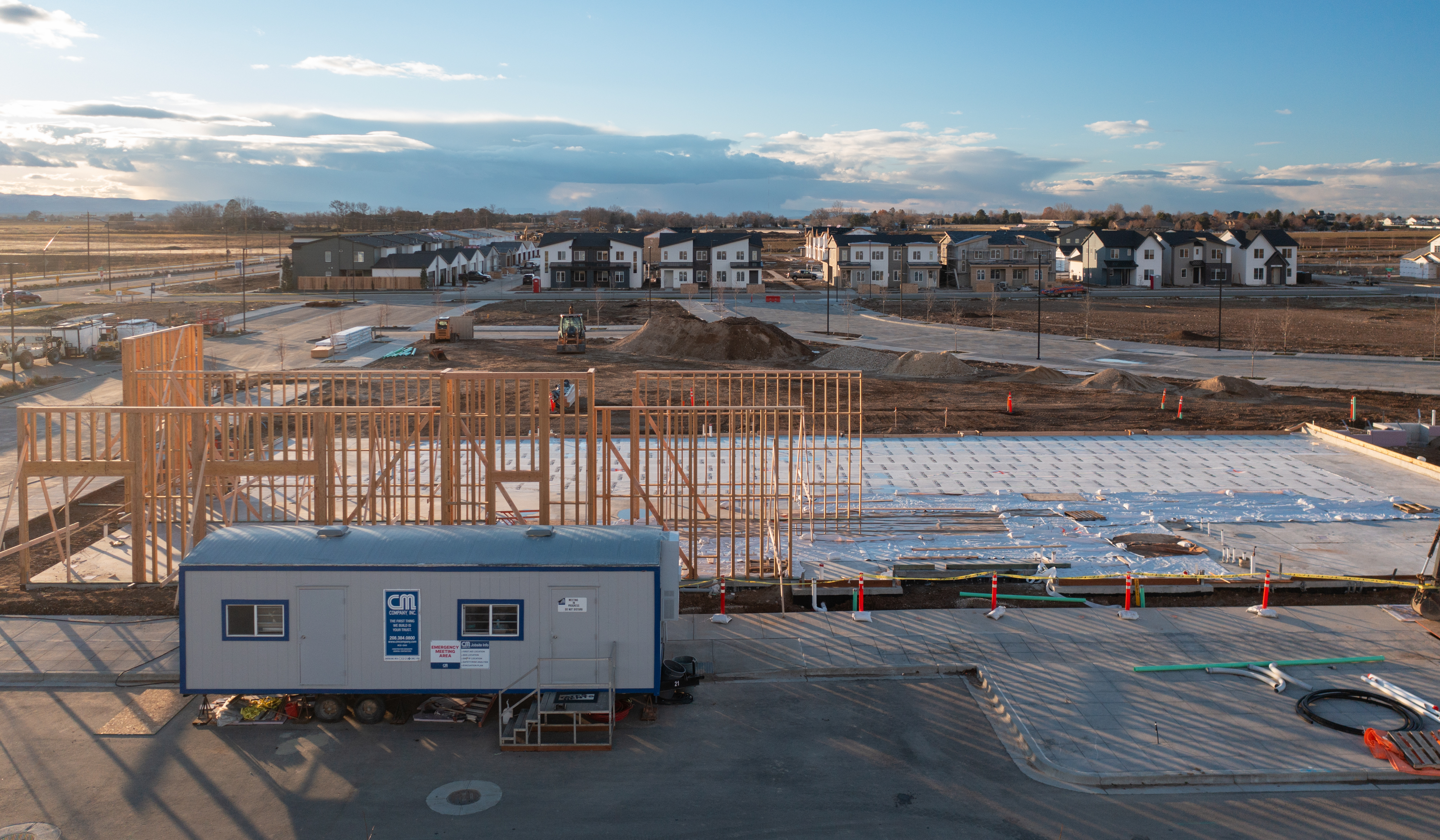 Pinnacle construction site with concrete set and framing starting to go up.