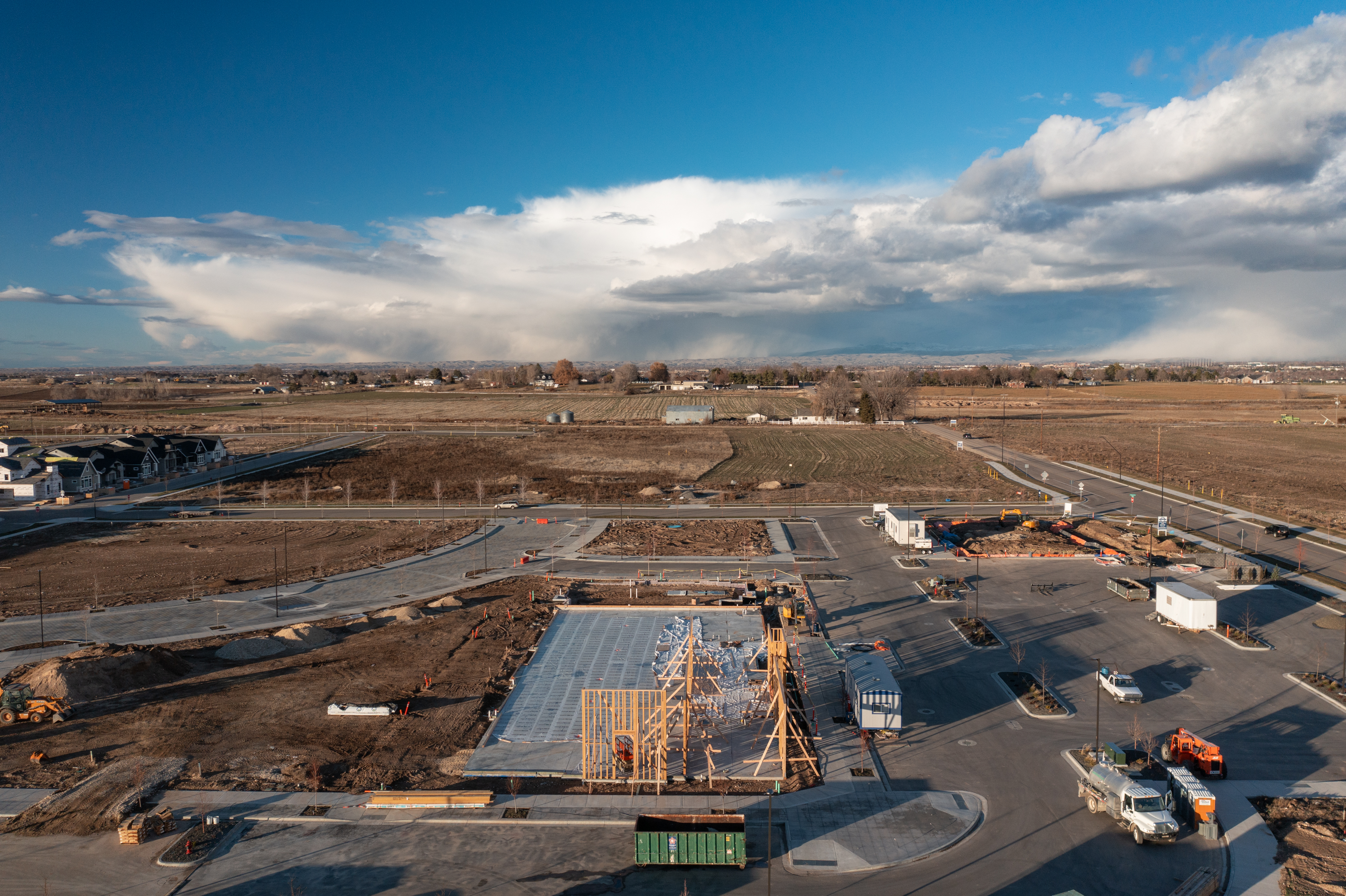 Pinnacle construction site with concrete set and framing starting to go up.