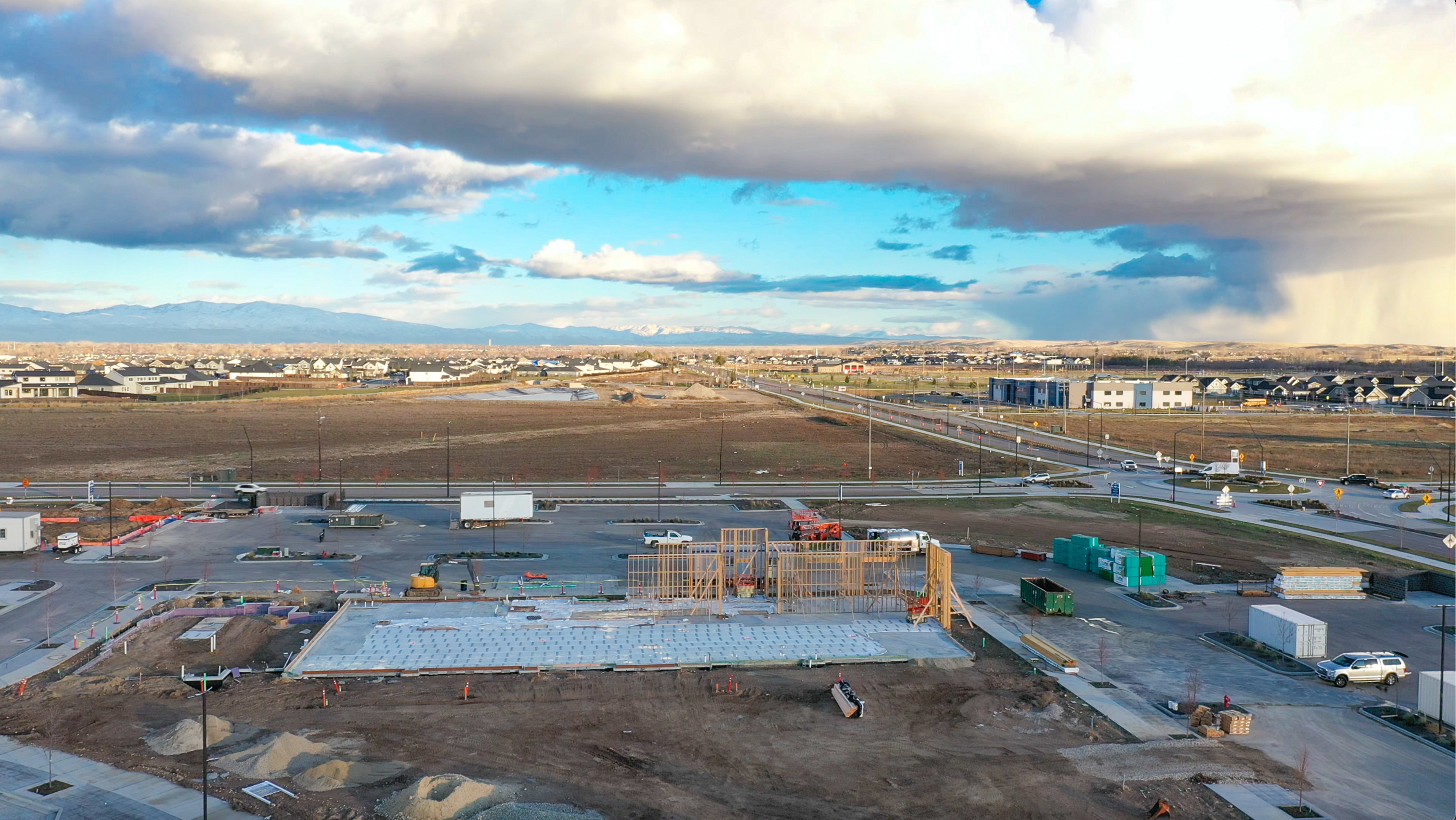 Pinnacle construction site with concrete set and framing starting to go up.