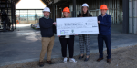 Meridian Library Foundation receiving a $250K grant check to support Orchard Park library